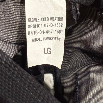 Close-up of a label on a pair of cold weather gloves with product details.